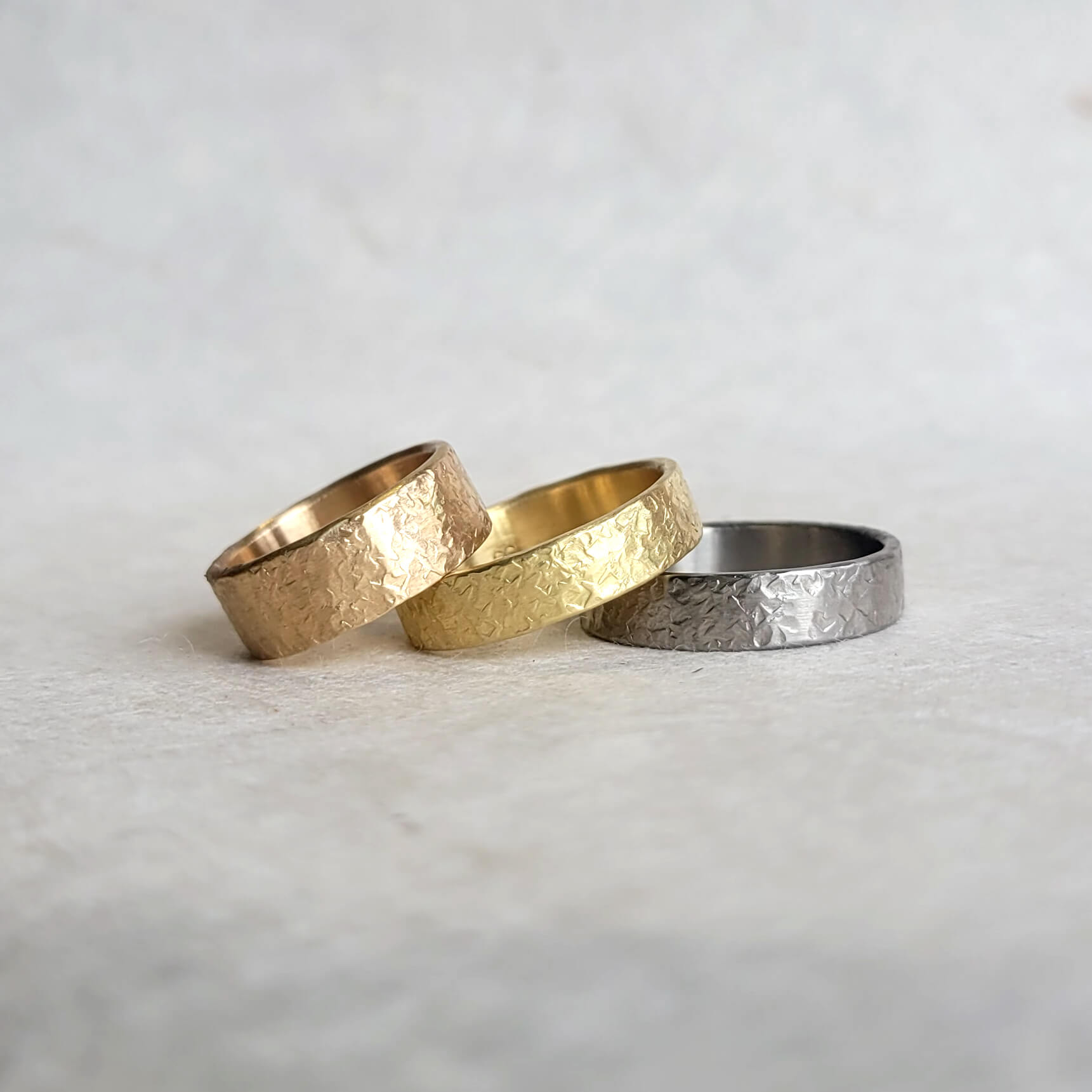 Silk hammered palladium wedding band made with recycled metal. EC Design Jewelry in Minneapolis, MN.