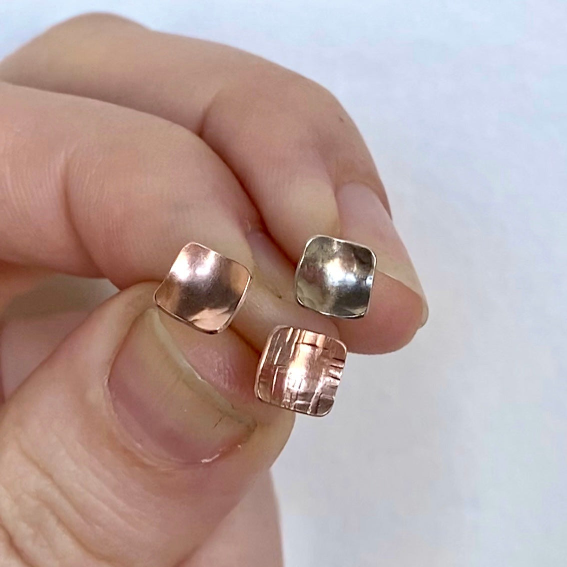 Concave cell studs in hammered rose gold and white gold. 