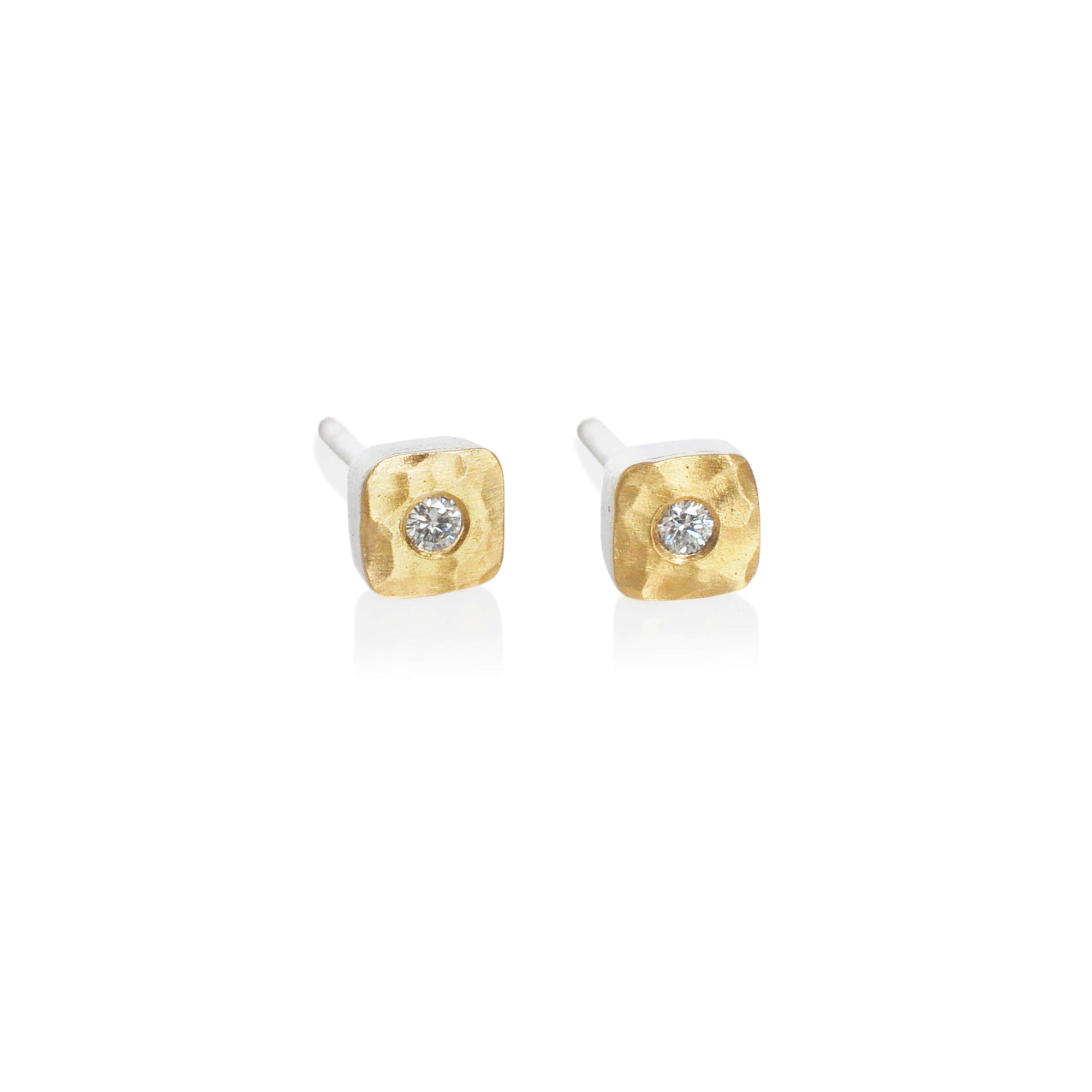 Silver and gold stud earrings with white diamonds. Handmade by EC Design Jewelry in Minneapolis, MN.