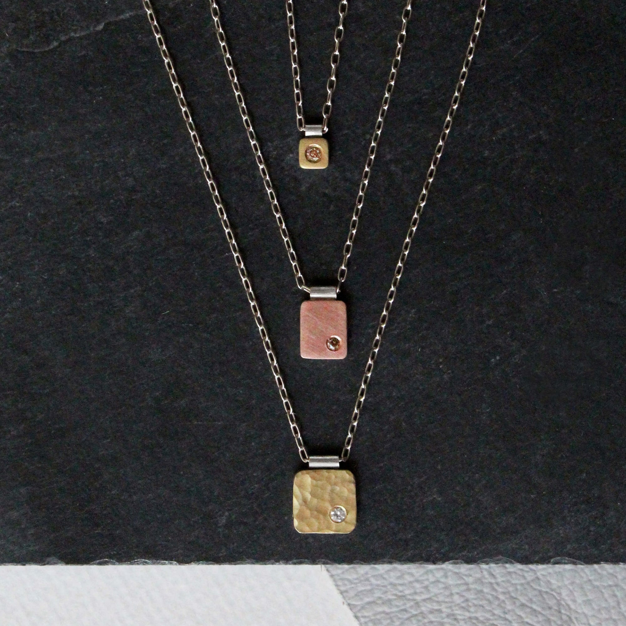 Hammered red gold and white diamond rectangle cell pendant. Handmade by EC Design Jewelry in Minneapolis, MN using recycled metal and conflict-free stone.