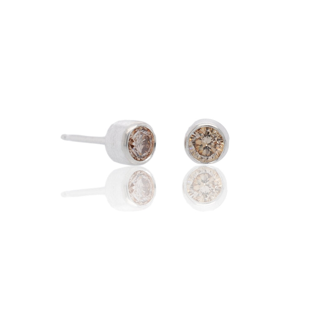 Sterling silver and round brilliant champagne diamond stud earrings. Handmade by EC Design Studio in Minneapolis, MN using recycled metal and conflict-free stones.