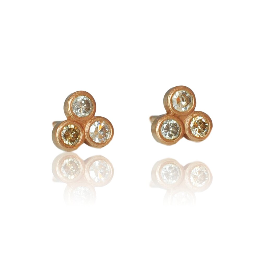 Mixed diamond 3 stone stud earrings in rose gold. Handmade by EC Design Jewelry in Minneapolis, MN.