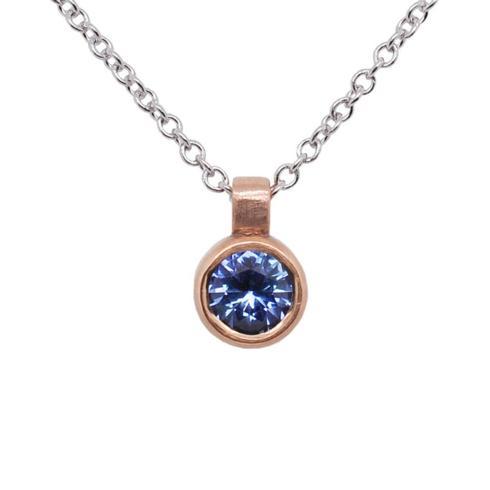 Blue Round Brilliant Sapphire and Rose Gold Bezel Set Necklace