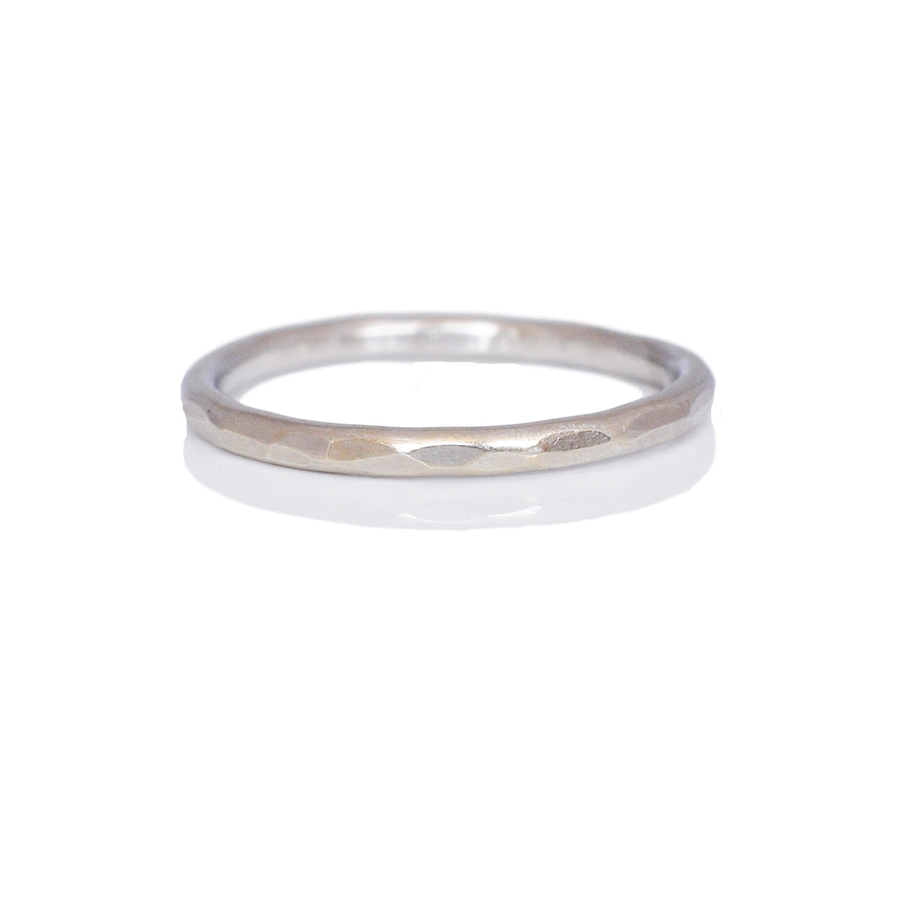 Simple and modern round hammered wedding band in 950 platinum. Handmade with recycled metal  by EC Design Studio in Minneapolis, MN.
