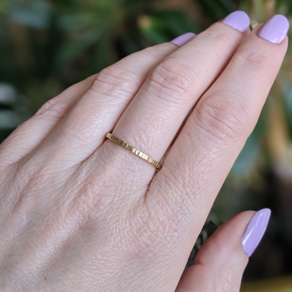 Linear hammered 18k yellow gold stacking band. Handmade by EC Design Studio in Minneapolis, MN using recycled metal.