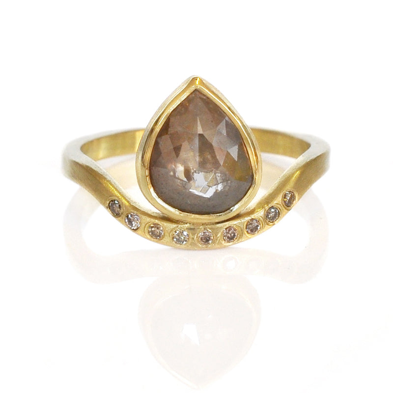 Pear shape diamond ring in yellow gold with flush set diamond band. Handmade by EC Design in Minneapolis, MN using recycled metal and conflict-free stones.