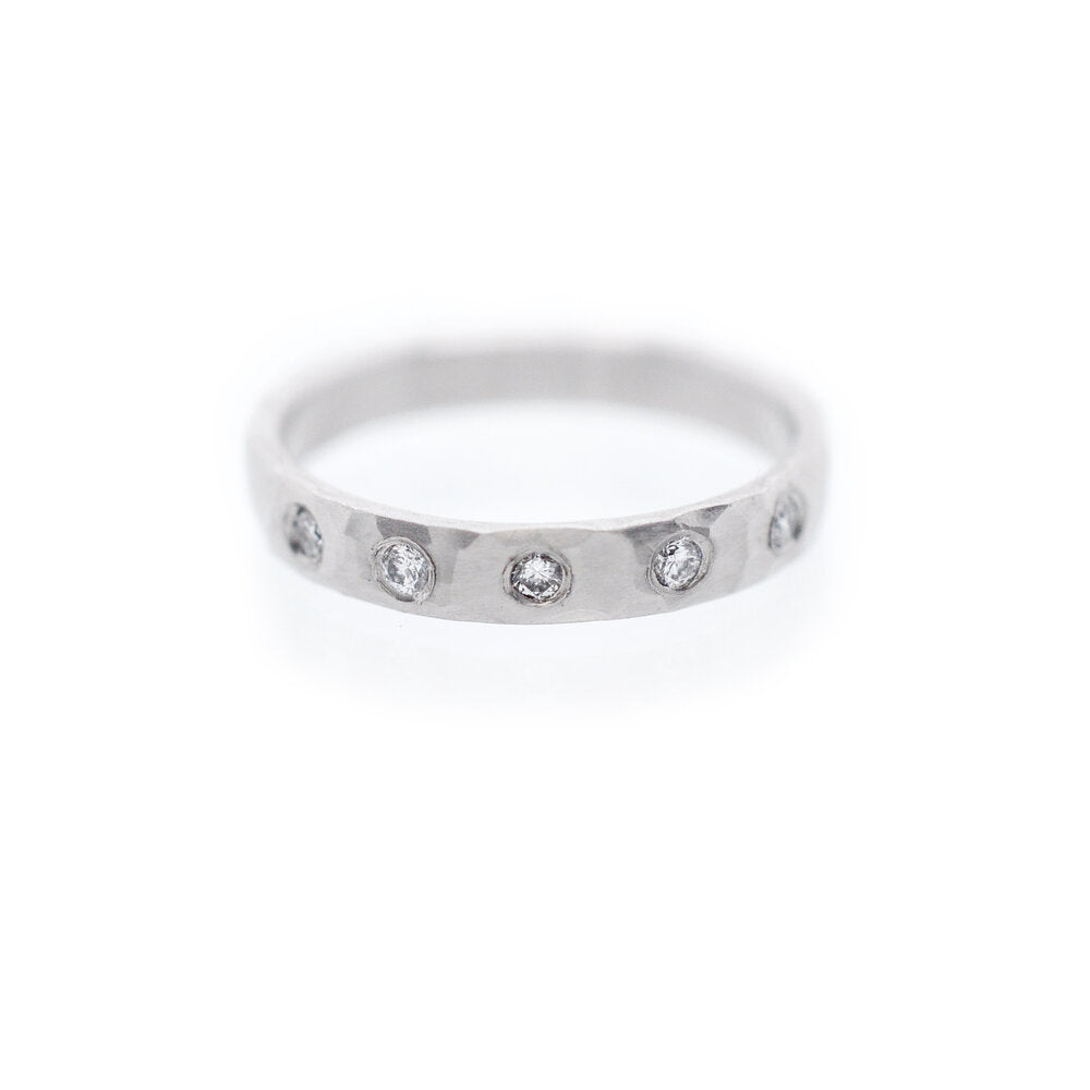 Palladium and diamond half-eternity band. Handmade by EC Design Studio in Minneapolis, MN using recycled metal and conflict-free stones.