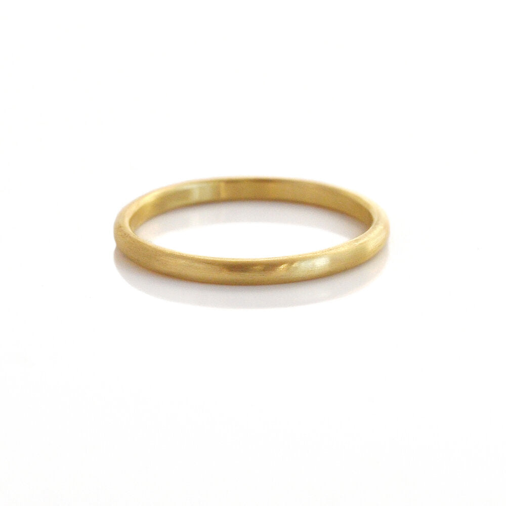 Yellow gold low dome wedding band. Handmade by EC Design Studio in Minneapolis, MN using recycled metal.