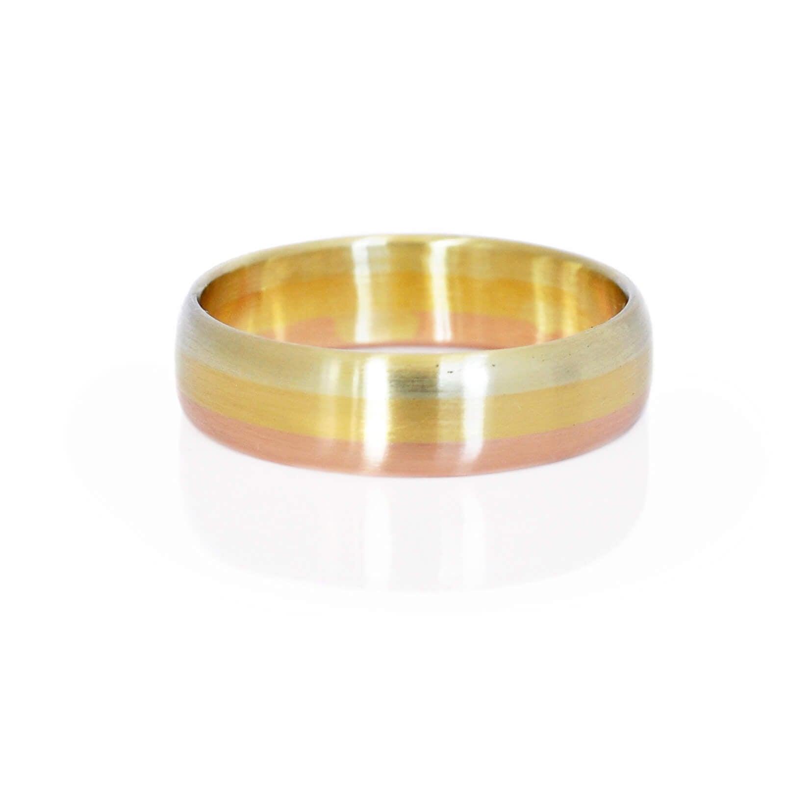 Satin finished low dome band in rainbow of green, yellow, and red gold. Handmade by EC Design Studio in Minneapolis, MN.