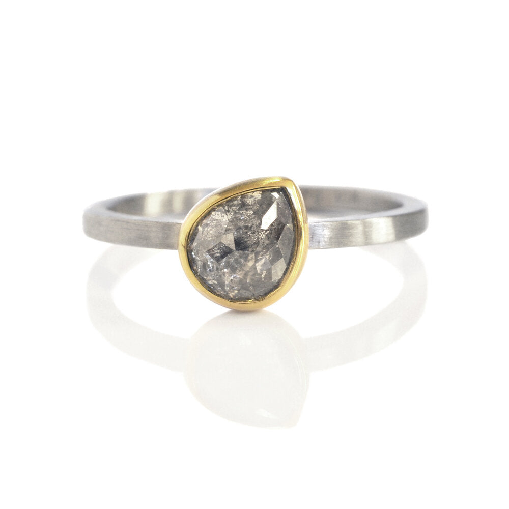 Ice gray teardrop diamond solitaire in yellow gold and palladium. Handmade by EC Design Jewerly in Minneapolis, MN using recycled metals and conflict-free stone.