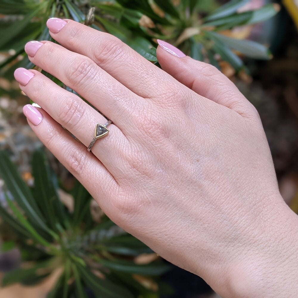 Rustic gray triangle diamond set in yellow gold on a palladium band. Handmade by EC Design Jewelry in Minneapolis, MN using recycled metal and conflict-free stone.