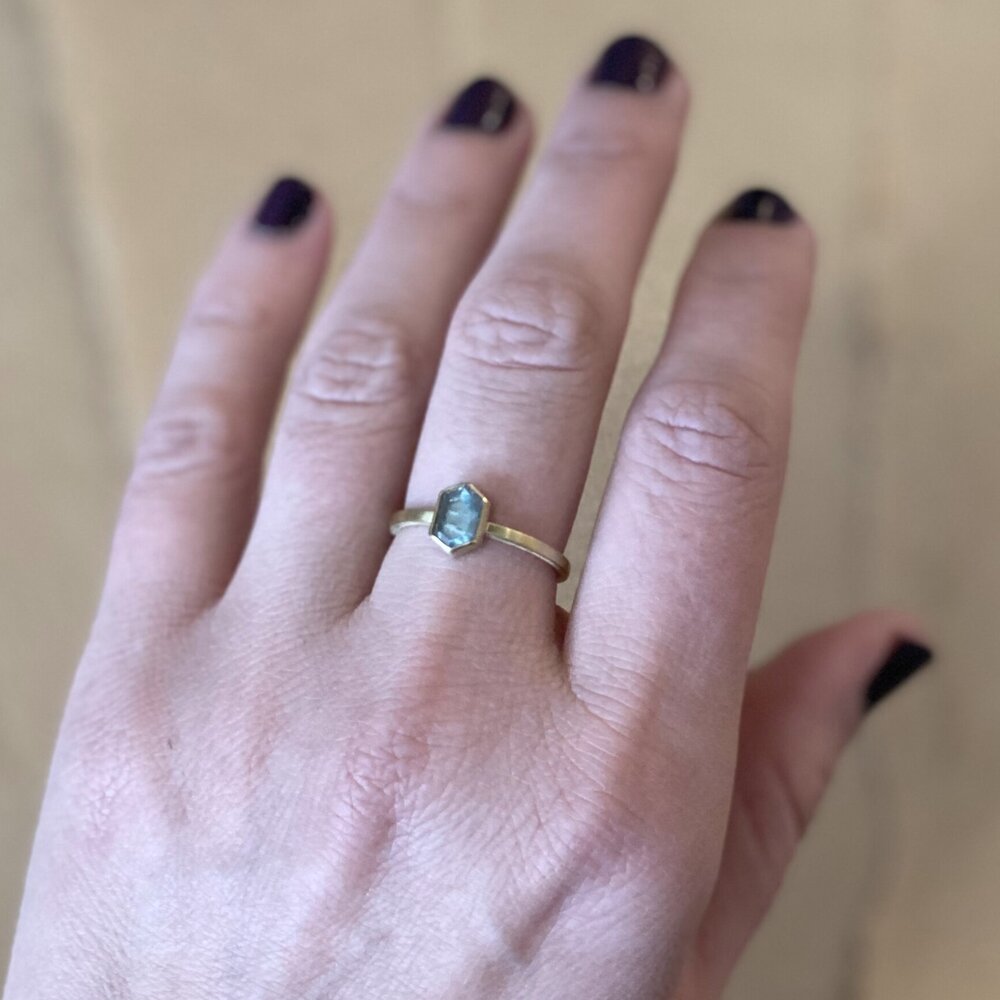 Blue-green rose cut hexagon sapphire set in 18k yellow gold. Handmade by EC Design Jewelry in Minneapolis, MN using recycled metal and conflict-free stone.