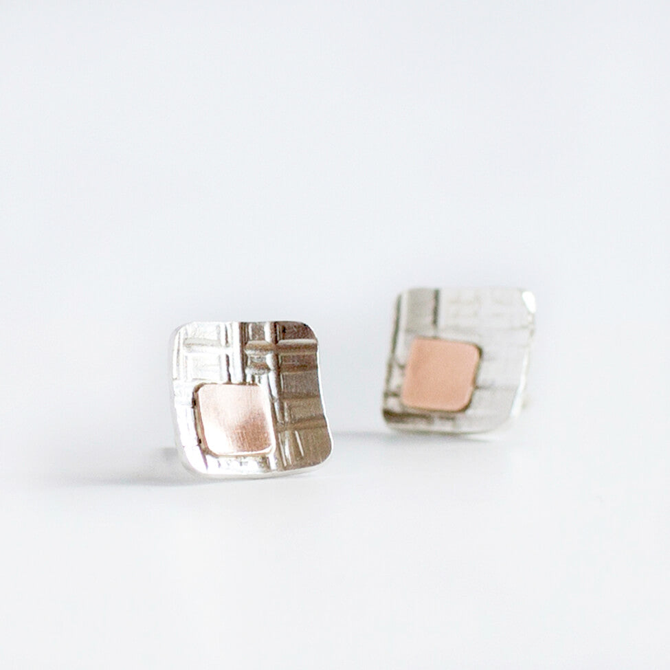 Sterling silver and rose gold concave cell earrings. Handmade by EC Design Jewelry in Minneapolis, MN.