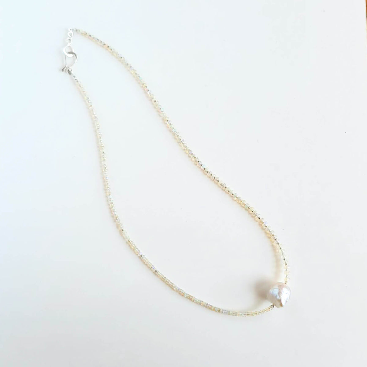 Iridescent Opal and Silver Necklace with a Baroque Pearl Center