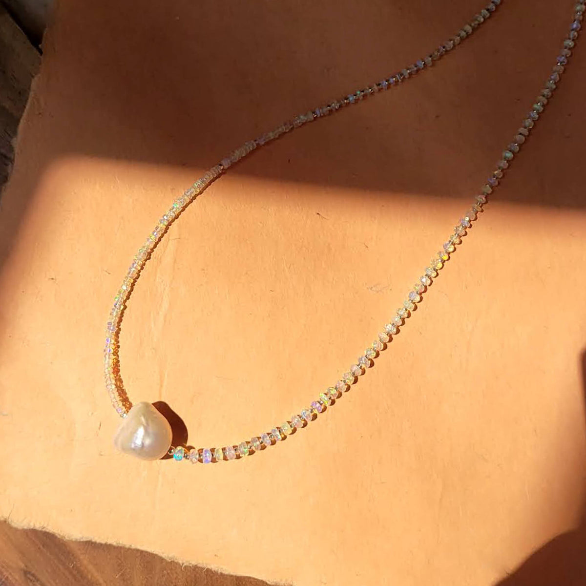 Iridescent Opal and Silver Necklace with a Baroque Pearl Center