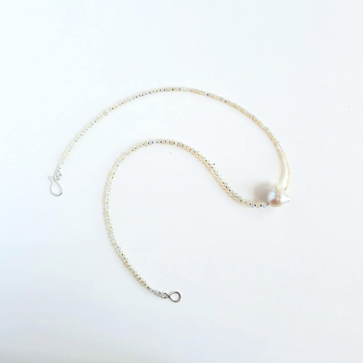 Iridescent Opal and Silver Necklace with a Baroque Pearl Center