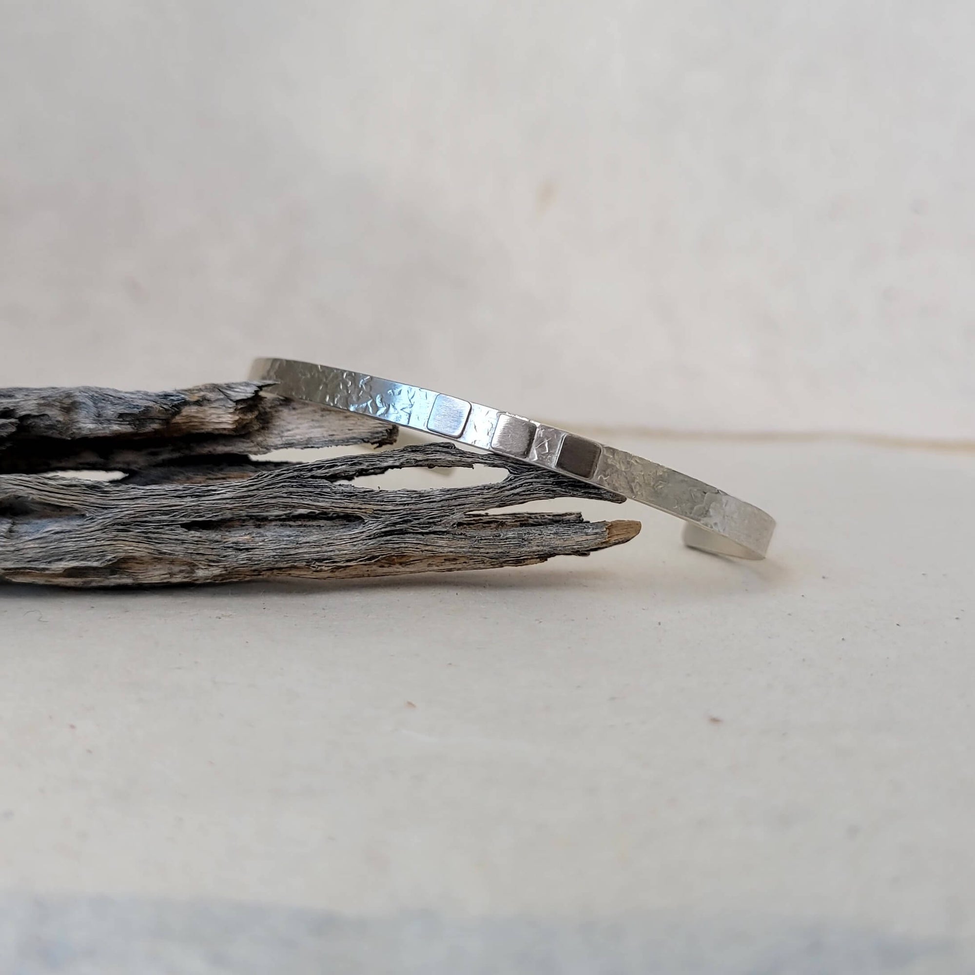 Handmade cuff bracelet made with recycled sterling silver and palladium.