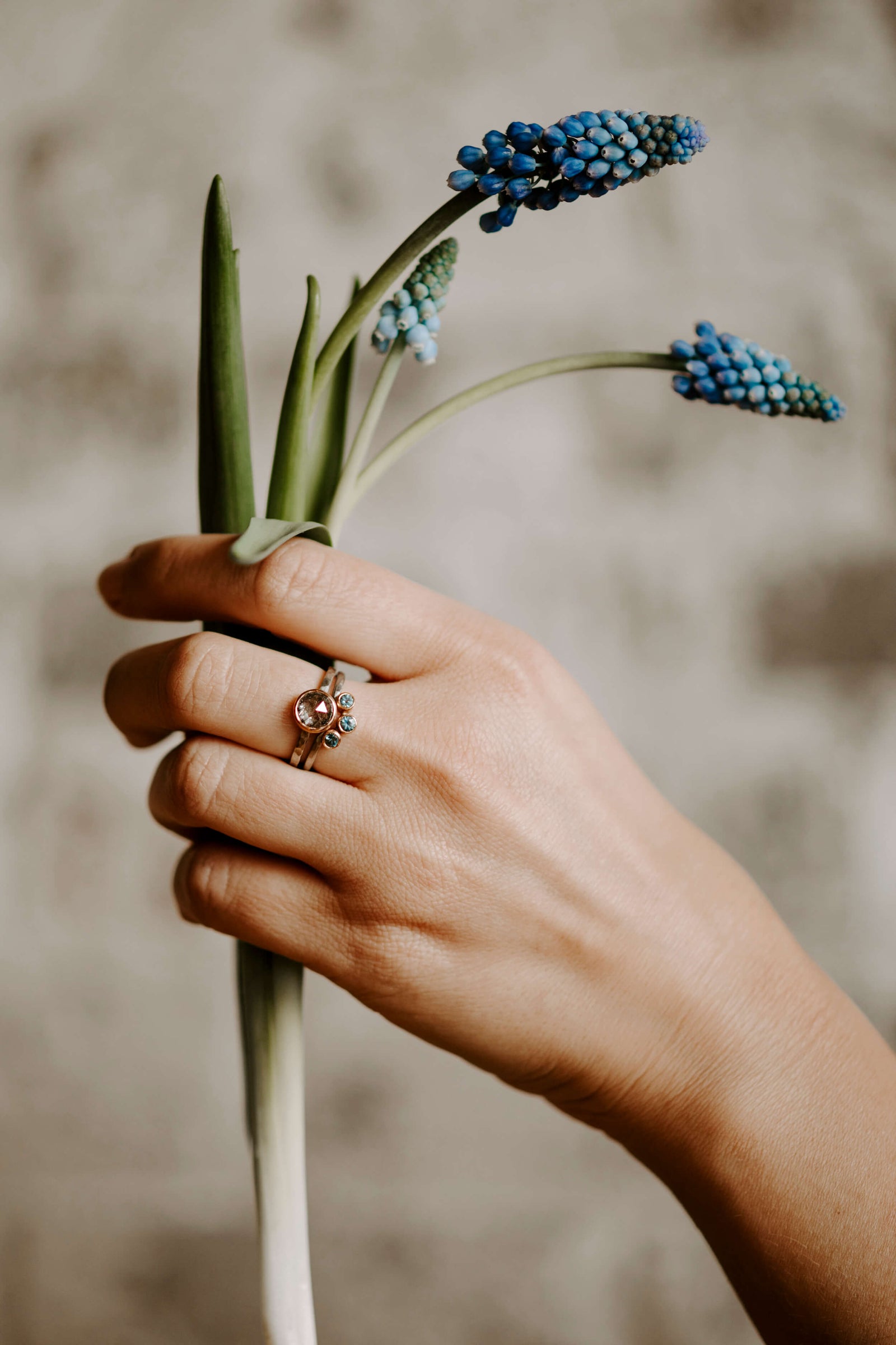 Sapphire solitaire and contour band from EC Design in Minneapolis, MN. Each ring is handmade with recycled metal and conflict-free stones.