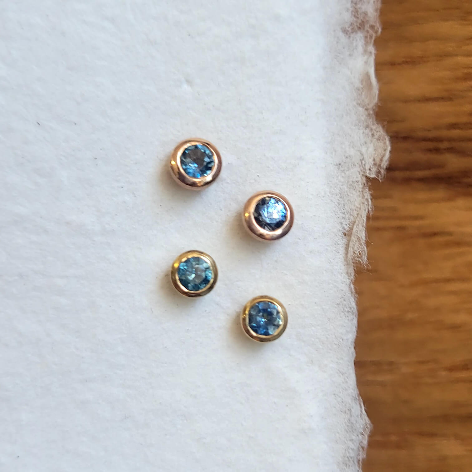 Montana sapphire stud earrings in recycled rose gold martini settings. Handmade by EC Design Jewelry in Minneapolis, MN.