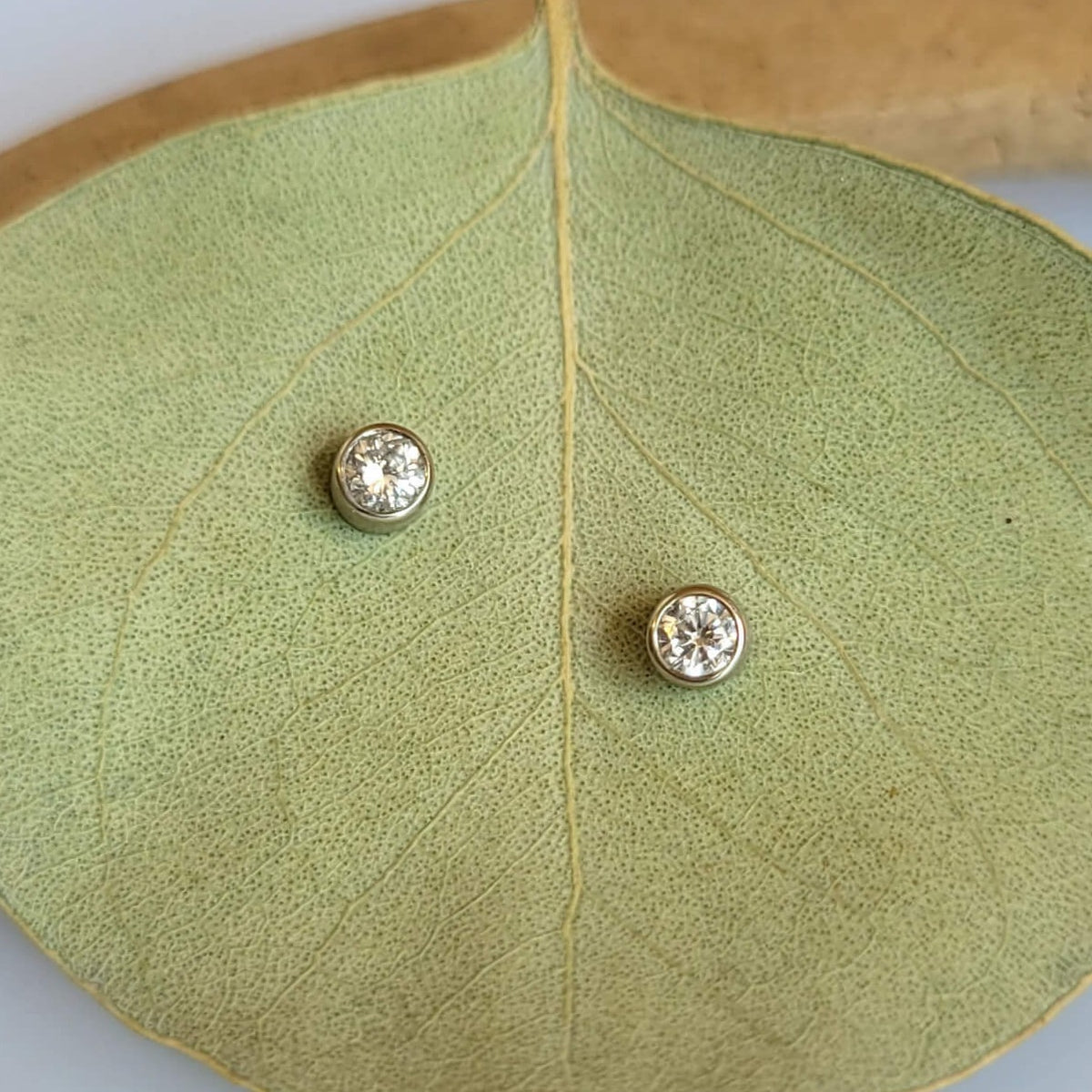 White diamond stud earrings.