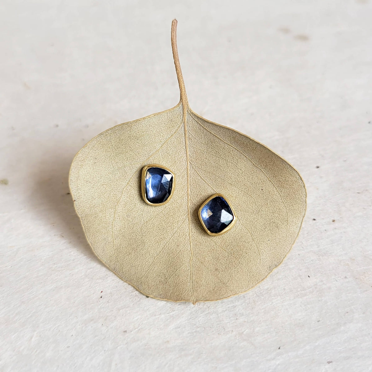 Free-form Blue Sapphire Stud Earrings in Yellow Gold Bezels