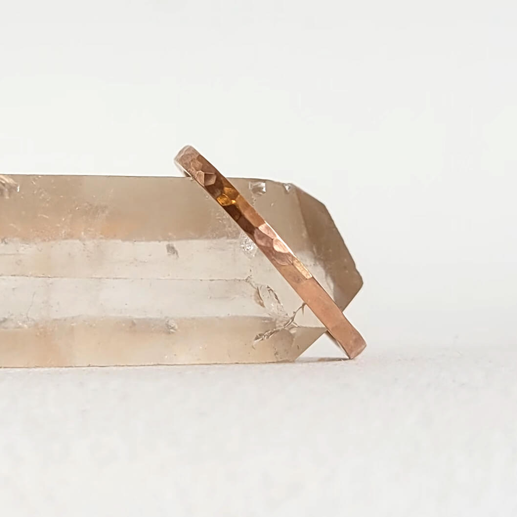 Hammered rose gold wedding band in a stackable 1.5mm size. Handmade by EC Design Jewelry in Minneapolis, MN.