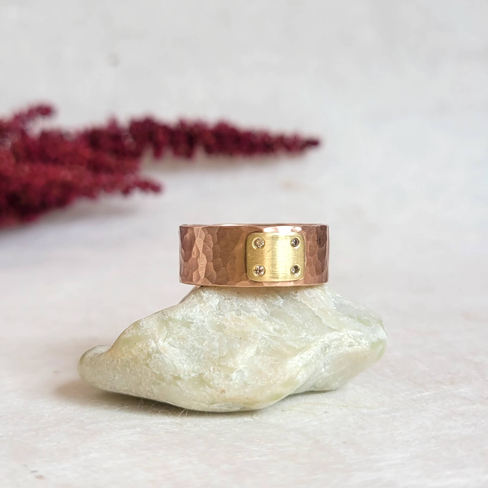 Red gold and yellow gold wide band with champagne diamond accents. Handmade by EC Design Jewelry in Minneapolis, MN using recycled metal.