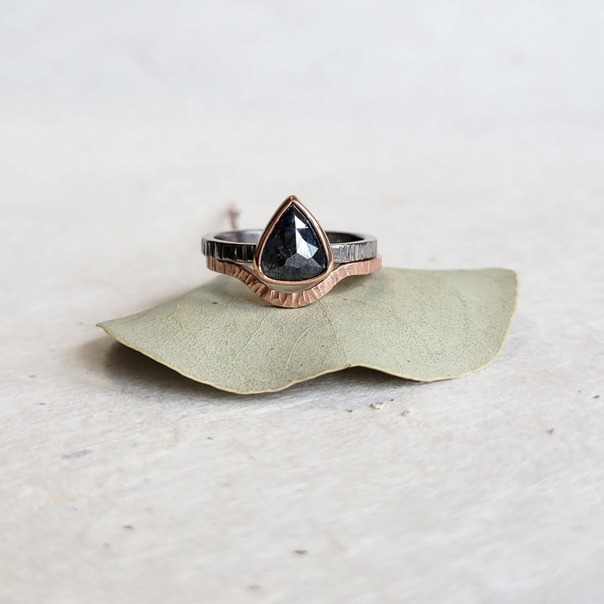 Dark Gray Pear Shaped Diamond Ring in Palladium and Rose Gold