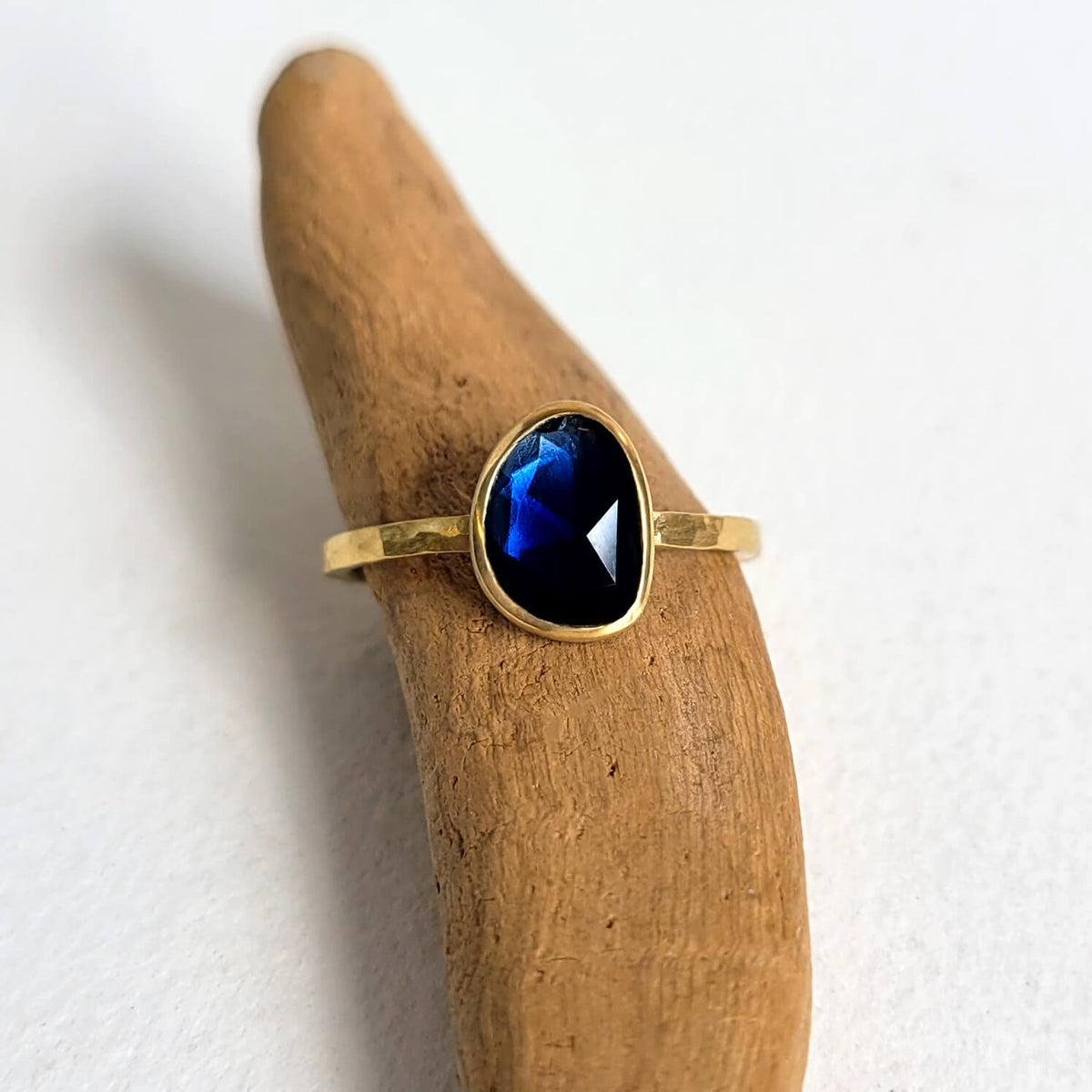 Deep Blue Organic Sapphire Ring in Hammered Gold