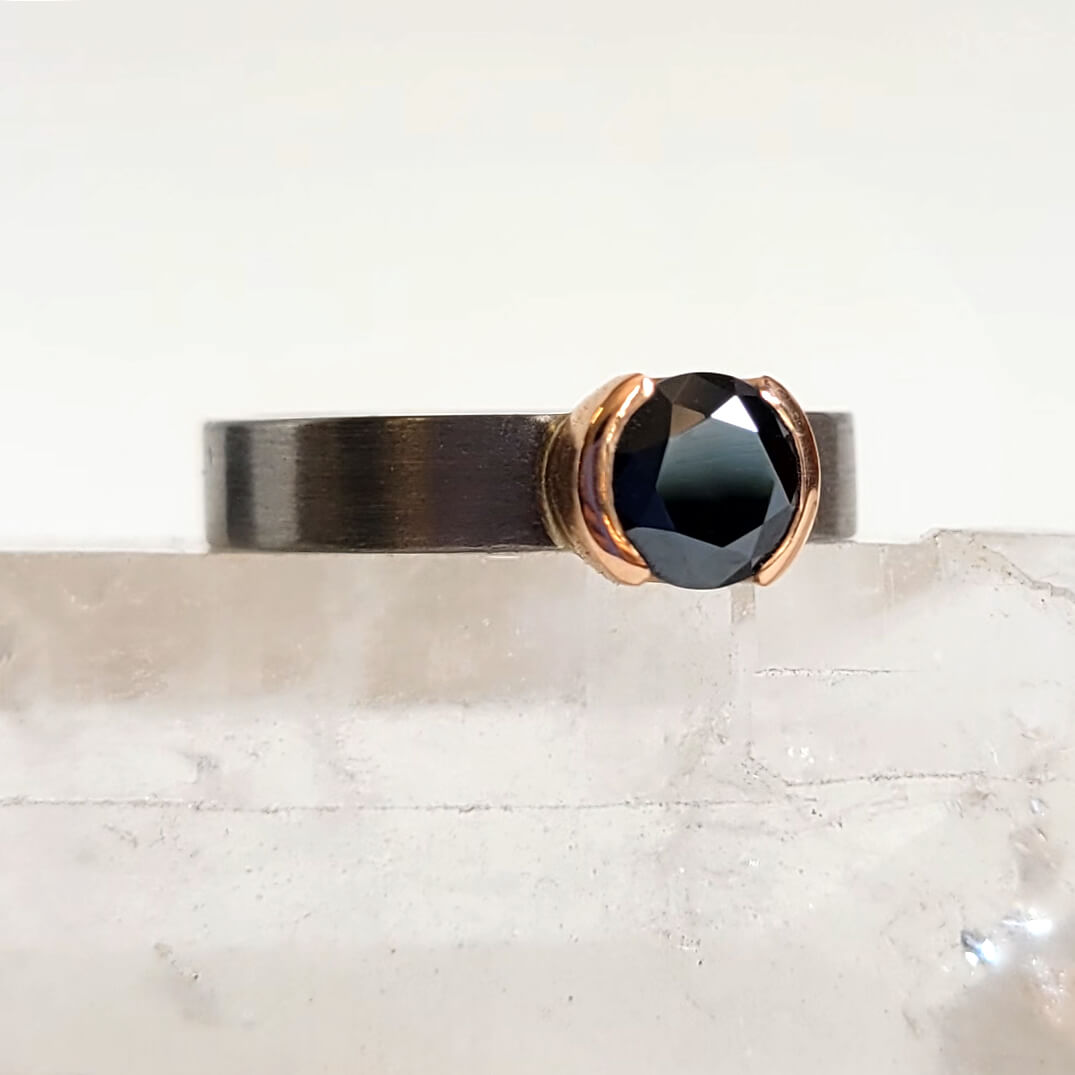Round Brilliant Black Moissanite Ring in a Half Bezel