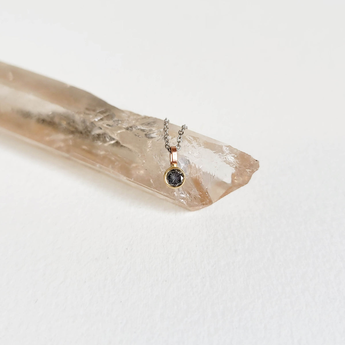 A Delicate Salt and Pepper Diamond Pendant in Mixed Golds