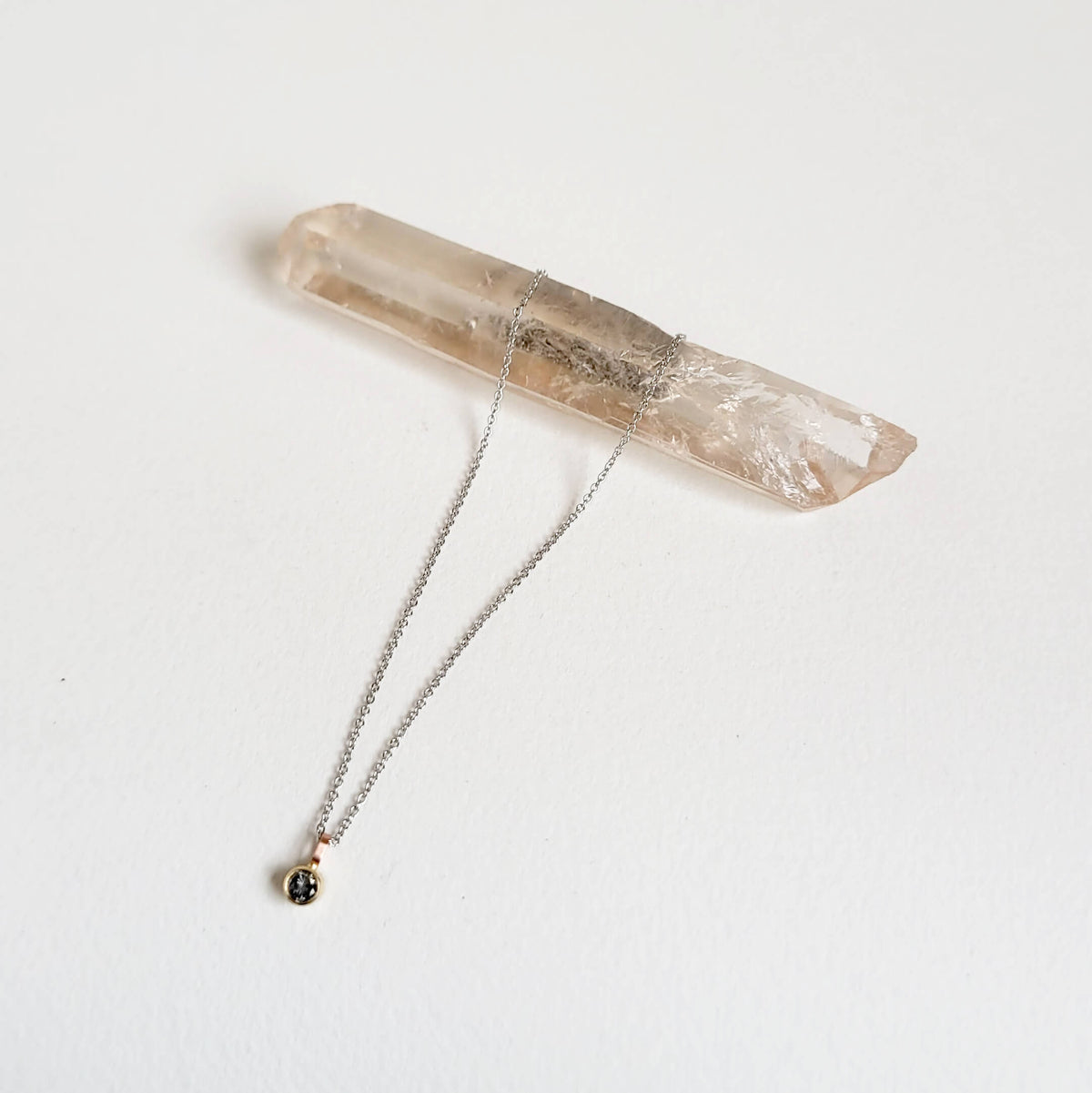 A Delicate Salt and Pepper Diamond Pendant in Mixed Golds