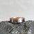 Rose gold and palladium diamond wedding band. Handmade by EC Design Jewelry in Minneapolis, MN.