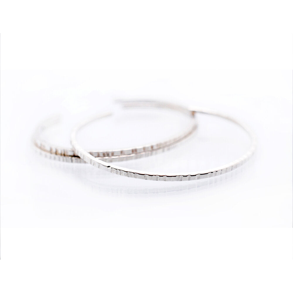 Linear hammered sterling silver cuff. Handmade with recycled metal by EC Design.