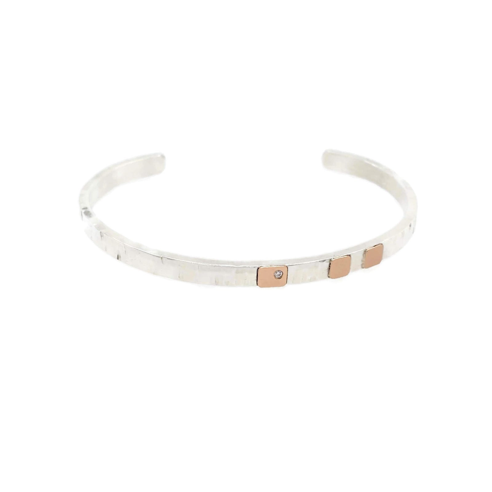 Hammered silver cuff with rose gold and diamond accent. Handmade by EC Design Jewelry in Minneapolis, MN.