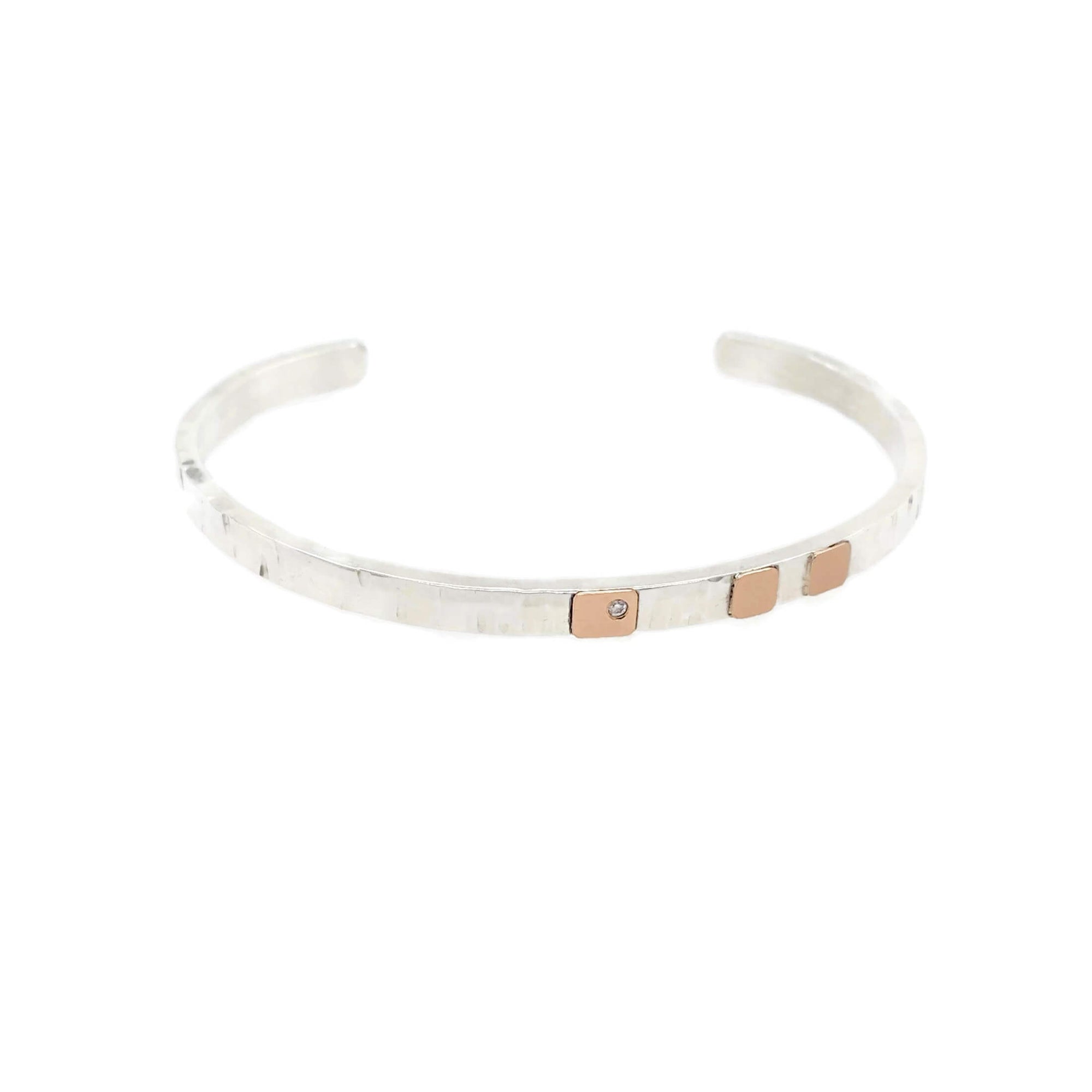 Hammered silver cuff with rose gold and diamond accent. Handmade by EC Design Jewelry in Minneapolis, MN.