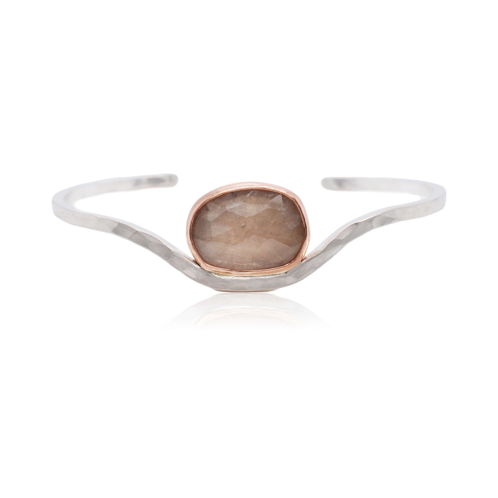 Hammered cuff bracelet with pale peach sapphire bezel set in rose gold.