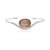 Hammered cuff bracelet with pale peach sapphire bezel set in rose gold.
