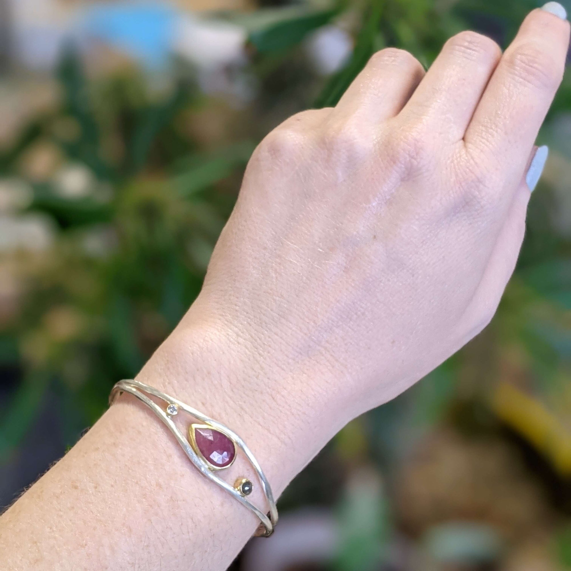 Hammered double cuff with rose cut pink sapphire and accent diamonds, all bezel set in yellow gold..