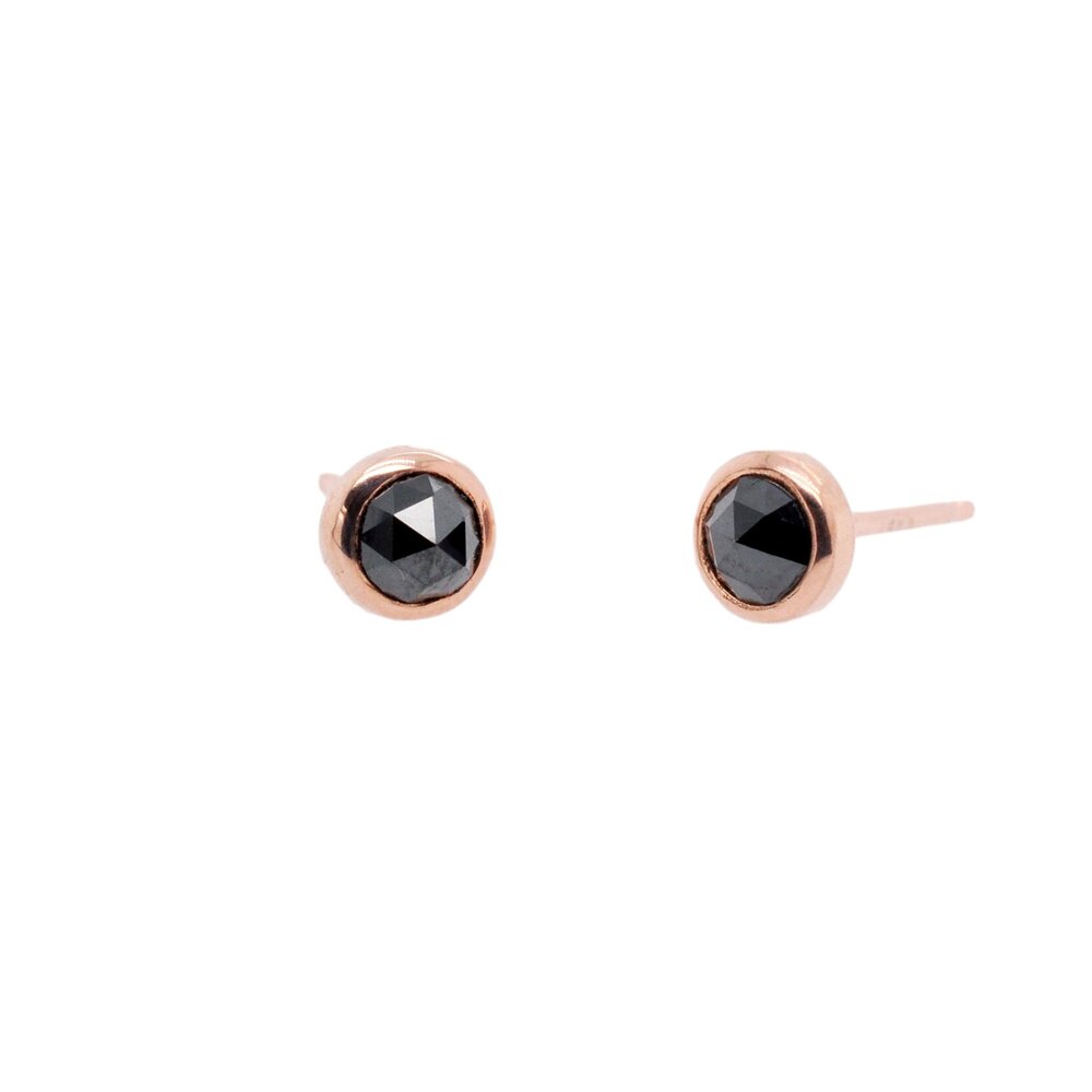Rose cut black diamond stud earrings in rose gold and yellow gold.