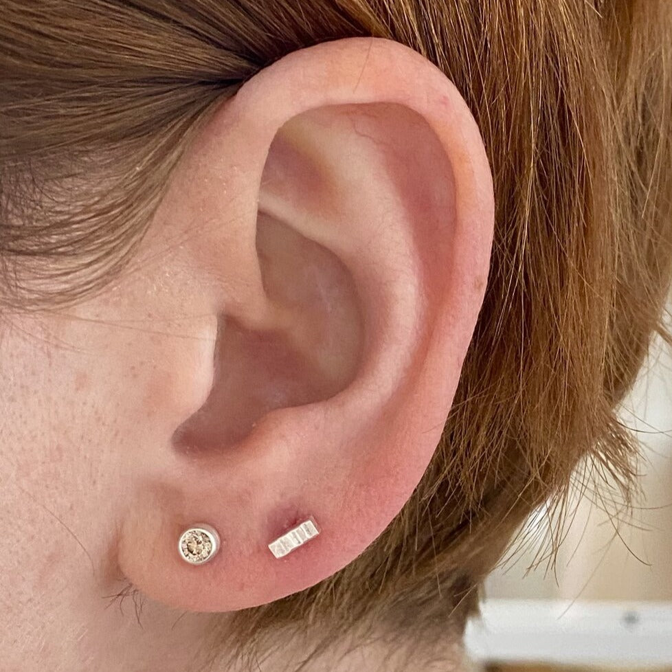Sterling silver and round brilliant champagne diamond stud earrings. Handmade by EC Design Studio in Minneapolis, MN using recycled metal and conflict-free stones.