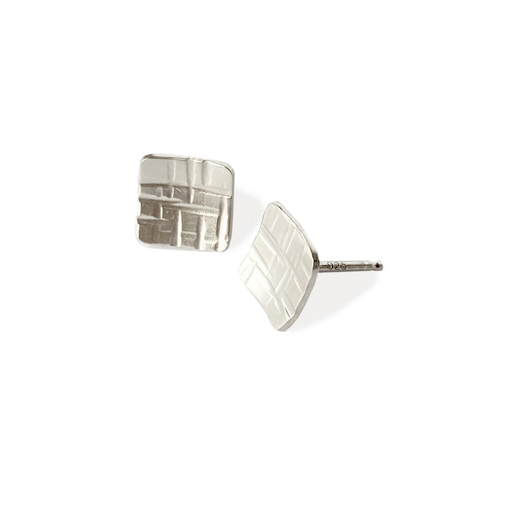Linear hammered sterling silver square studs. Handmade by EC Design Studio in Minneapolis, MN using recycled metal.
