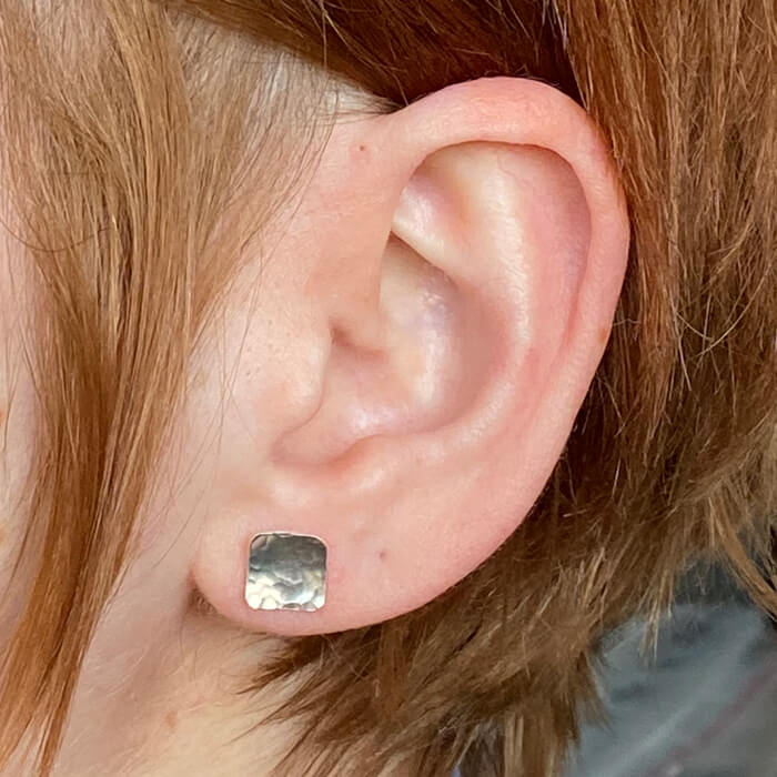 Round hammered sterling silver square studs. Handmade by EC Design Studio in Minneapolis, MN using recycled metal.