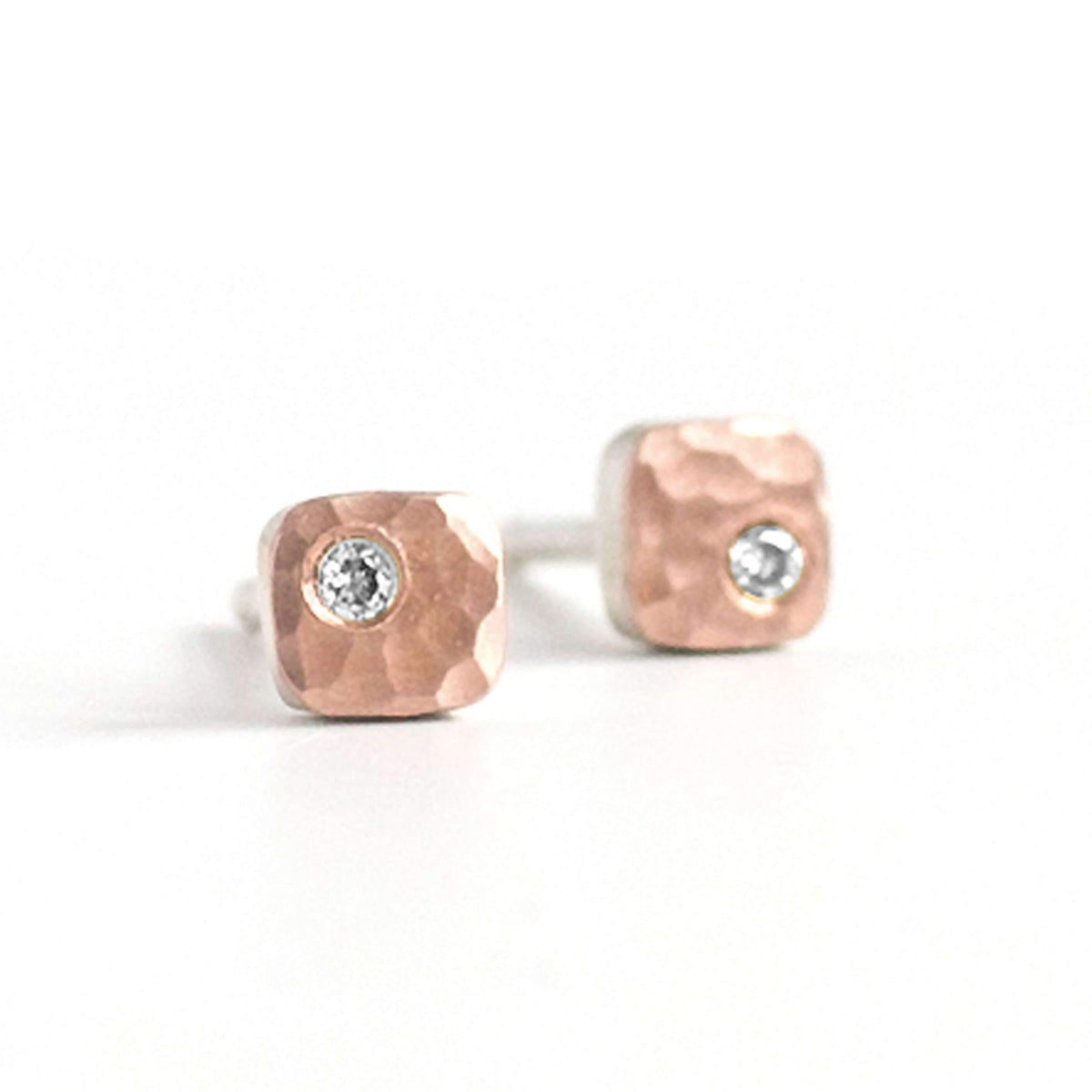 Hammered rose gold and white diamond square studs. Handmade by EC Design Jewelry in Minneapolis, MN.