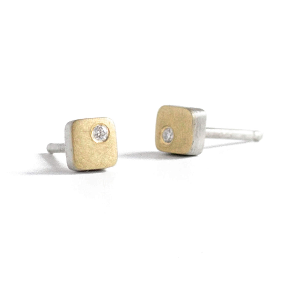 Satin finished yellow gold and silver square studs with white diamonds. 