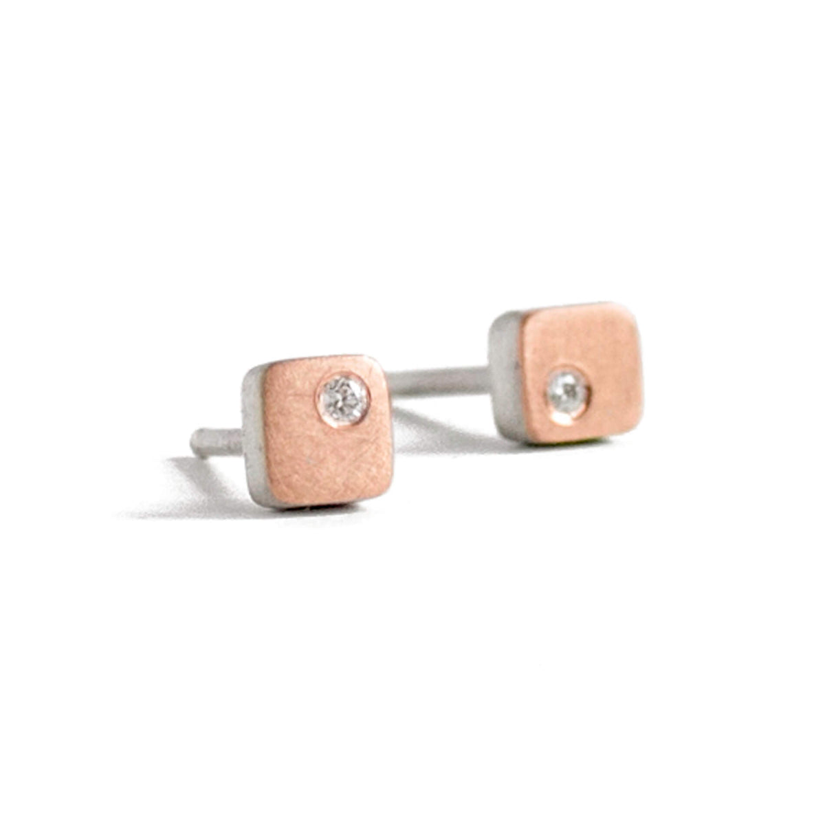 Satin finished red gold and silver square studs with white diamonds. 