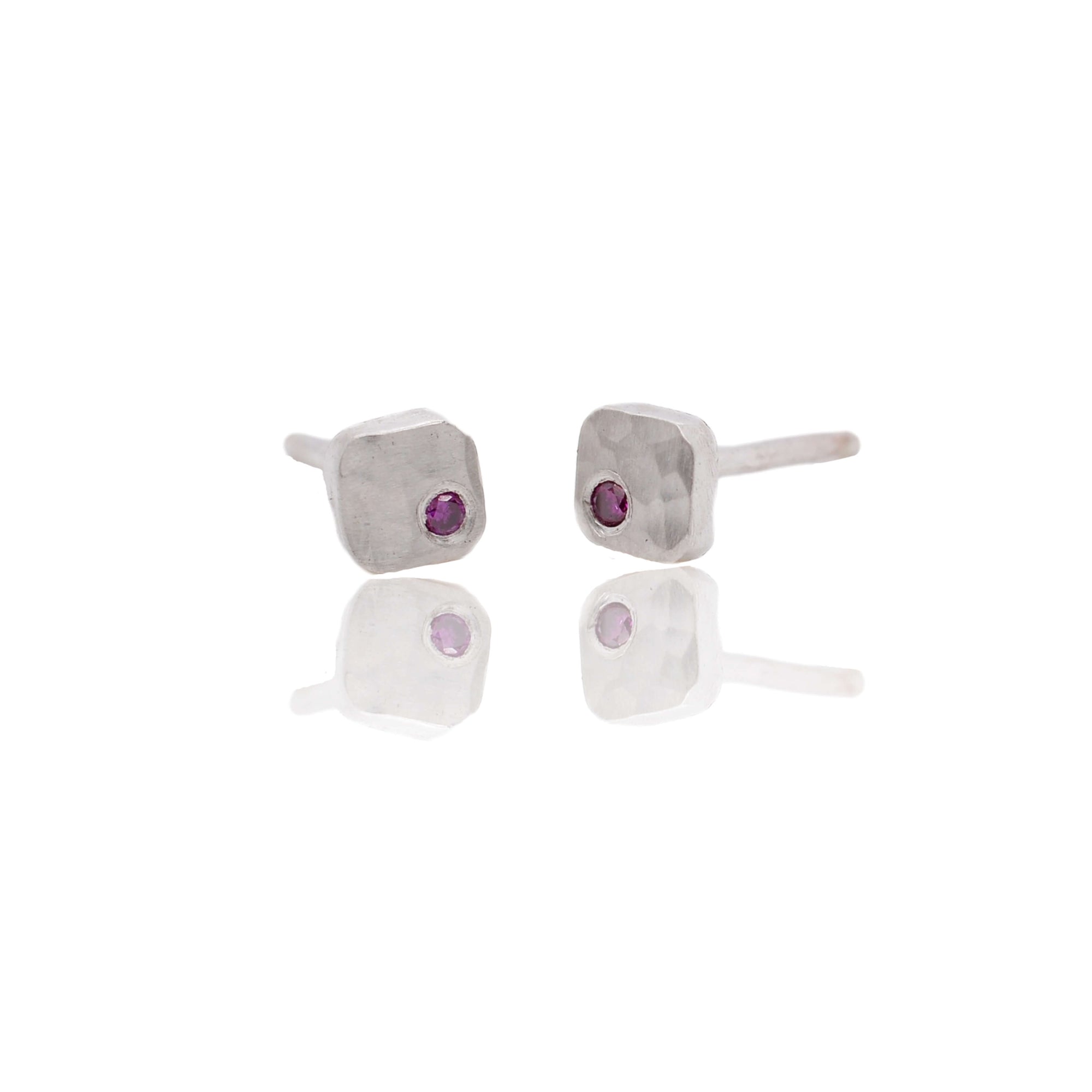 Hammered sterling silver studs with purple diamonds. Handmade with recycled metal and conflict-free stones.