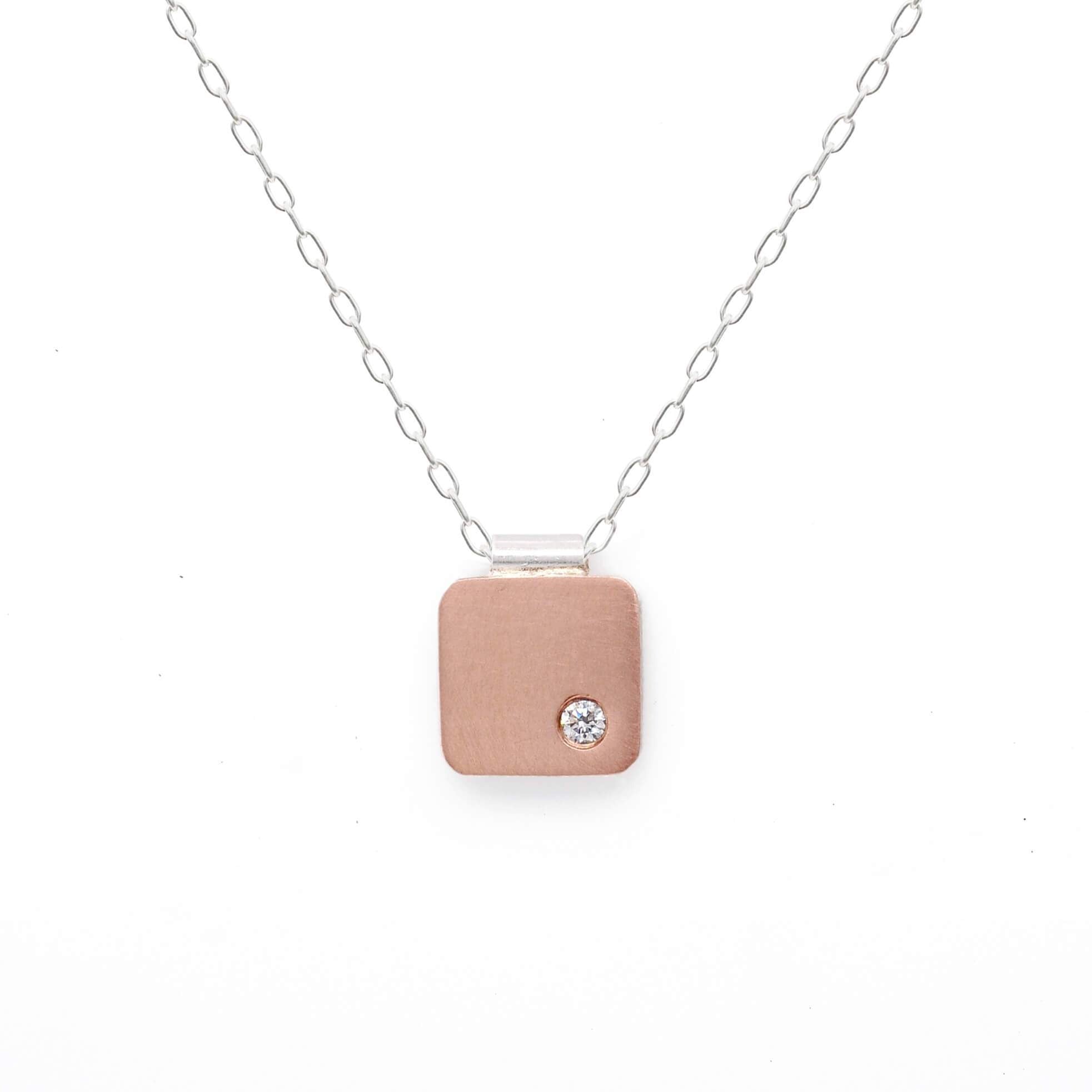 Handmade rose gold and diamond cell pendant. Made by EC Design Studio in Minneapolis, MN using recycled metal and conflict-free stone.