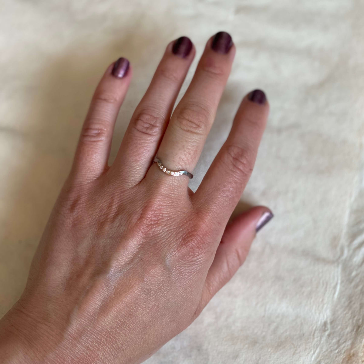 Rose gold and palladium contour band with diamond accents. Handmade by EC Design Jewelry in Minneapolis, MN.