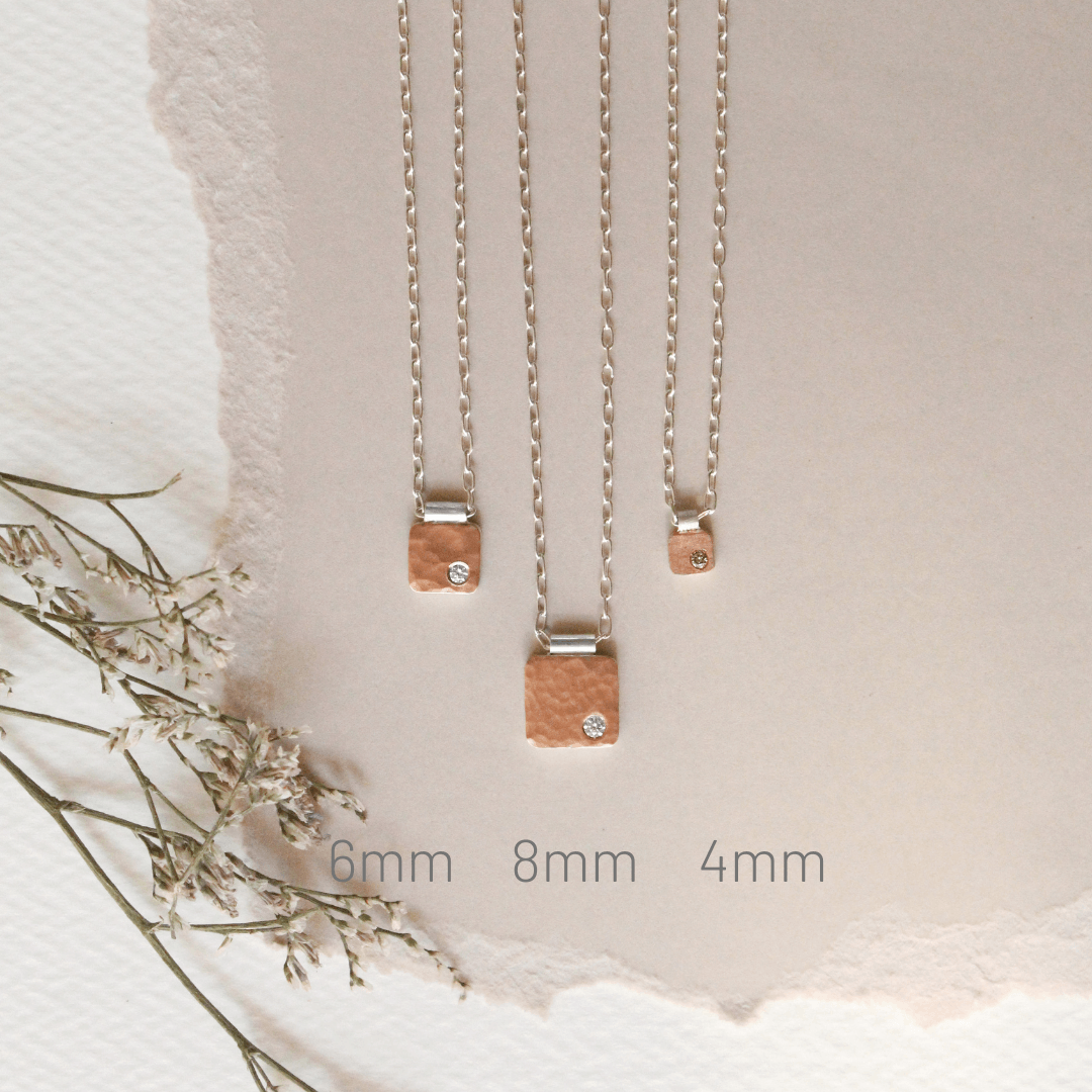 Hammered 14k red gold cell pendant with diamond accent. Handmade by EC Design Studio in Minneapolis, MN using recycled metal and conflict-free stone.